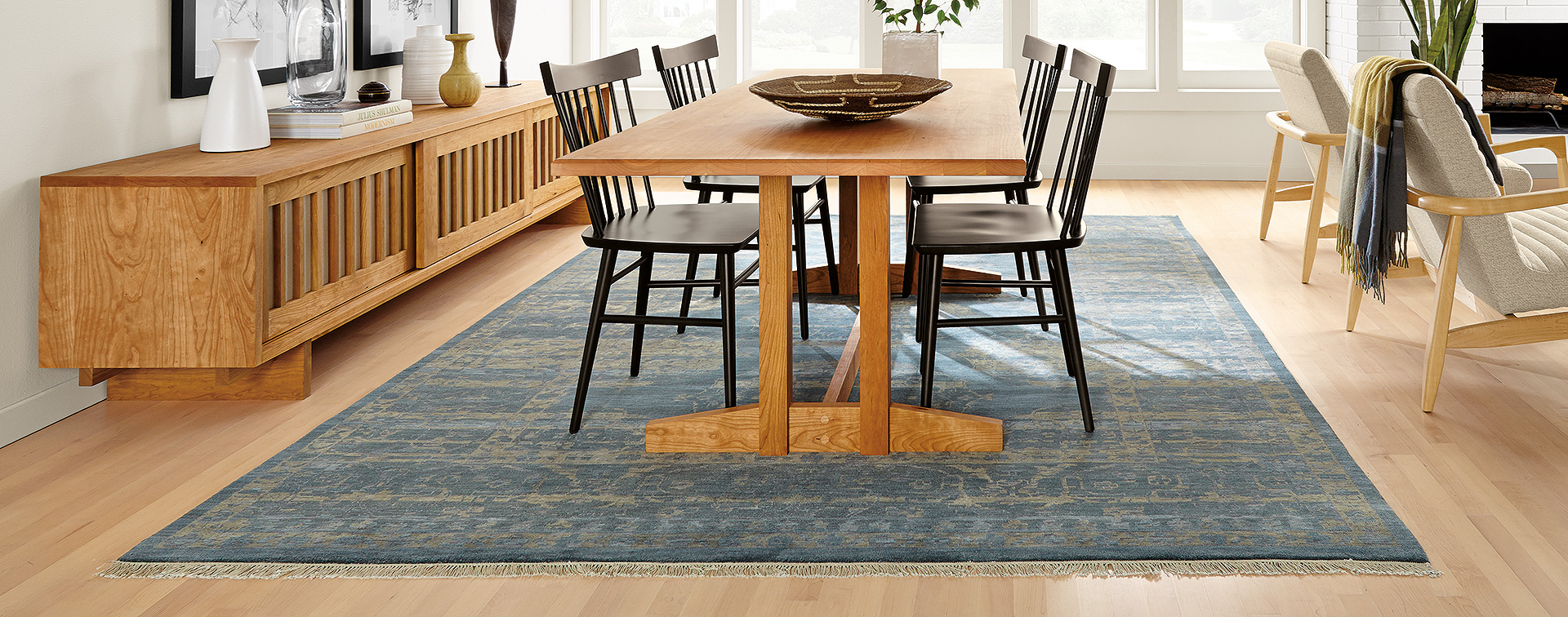 Hart wood dining table with Sivas blue rug for open concept space