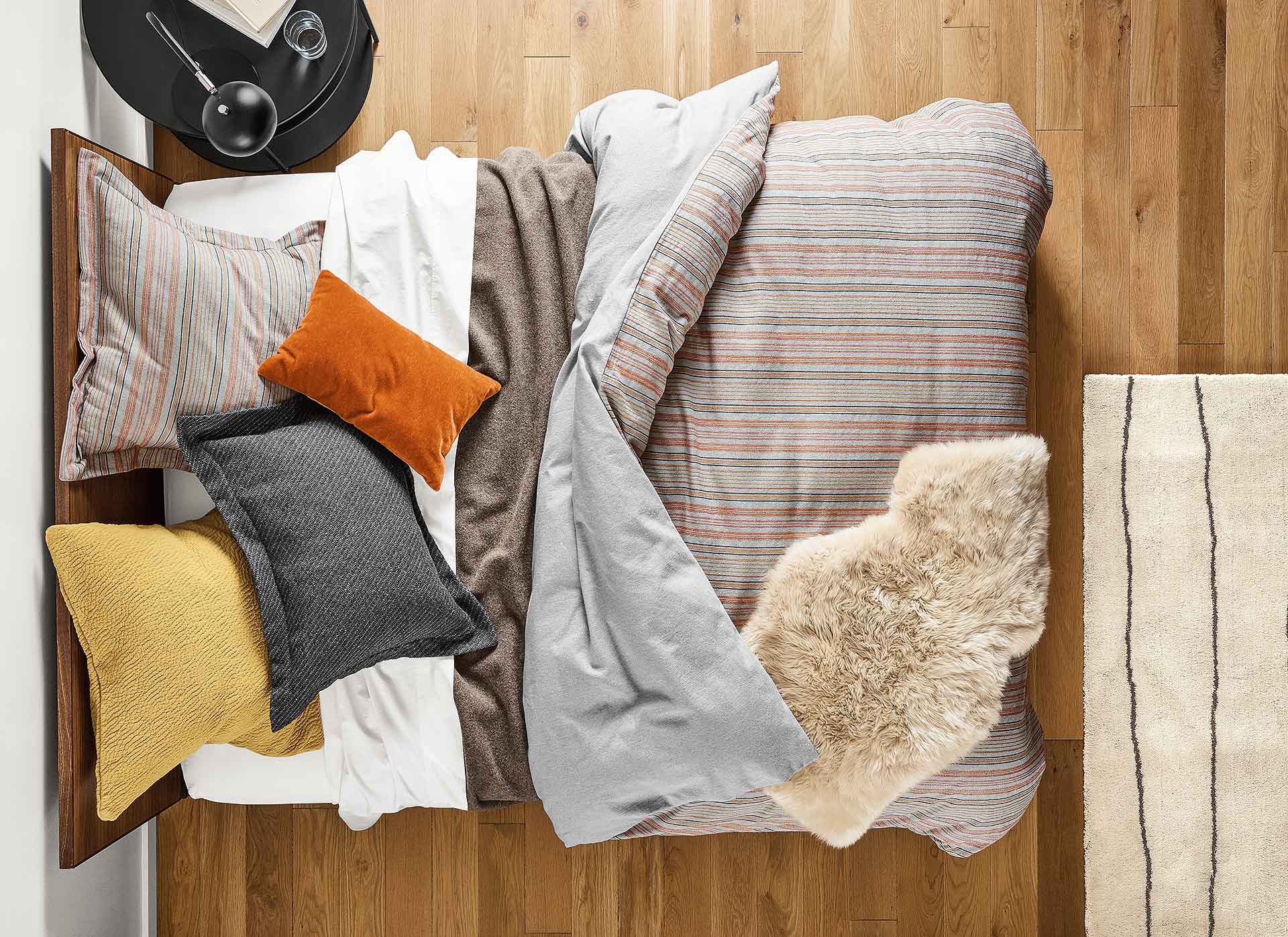 Bedroom ready for fall with layered bedding