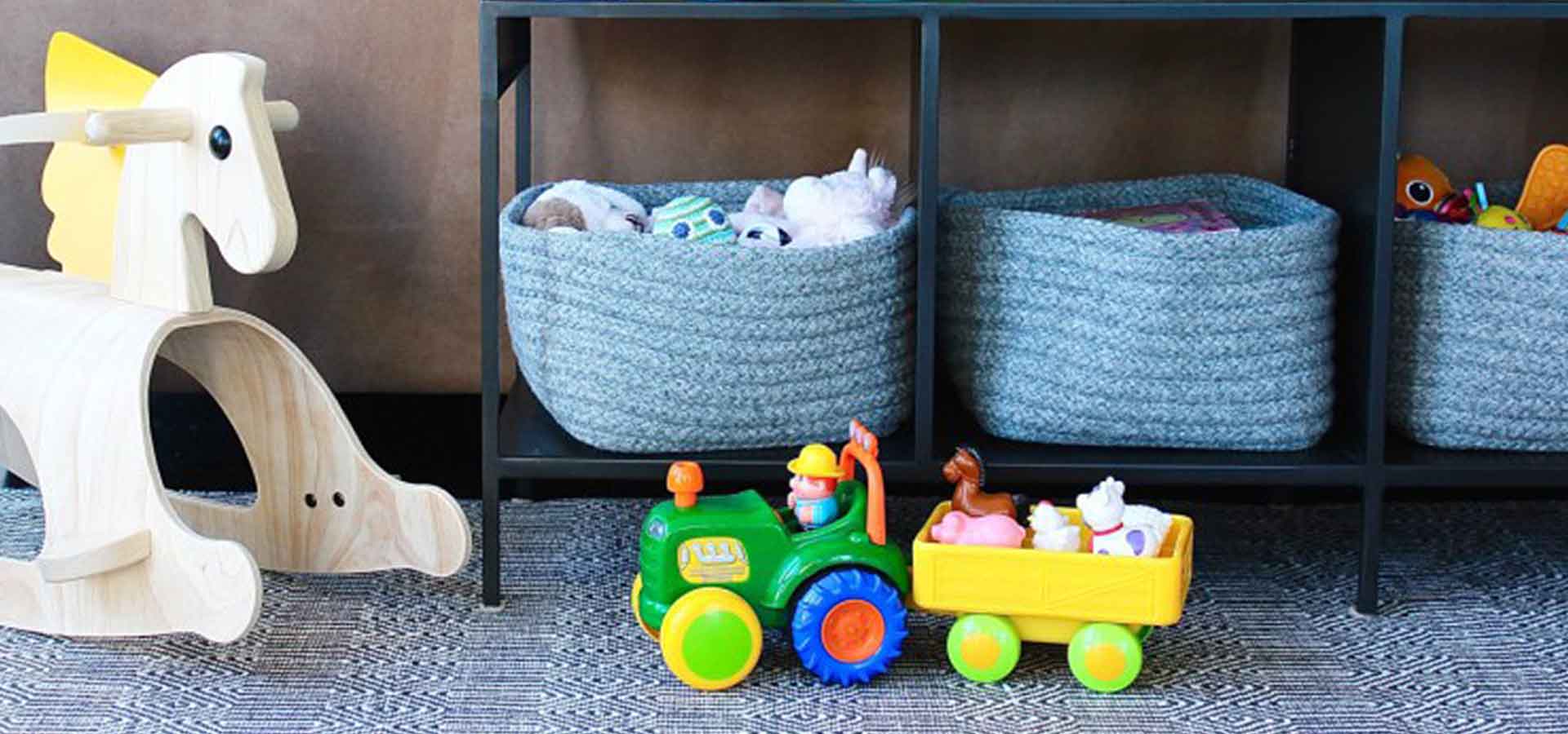 Functional play area with book and toy storage