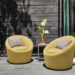 Outdoor space with two Crest swivel chairs in Pelham Citron fabric.