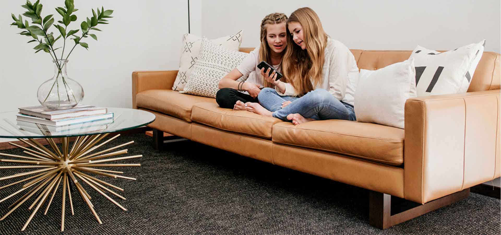 Leather sofa with two people sitting on it