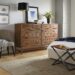 Berkeley walnut dresser in a modern bedroom.