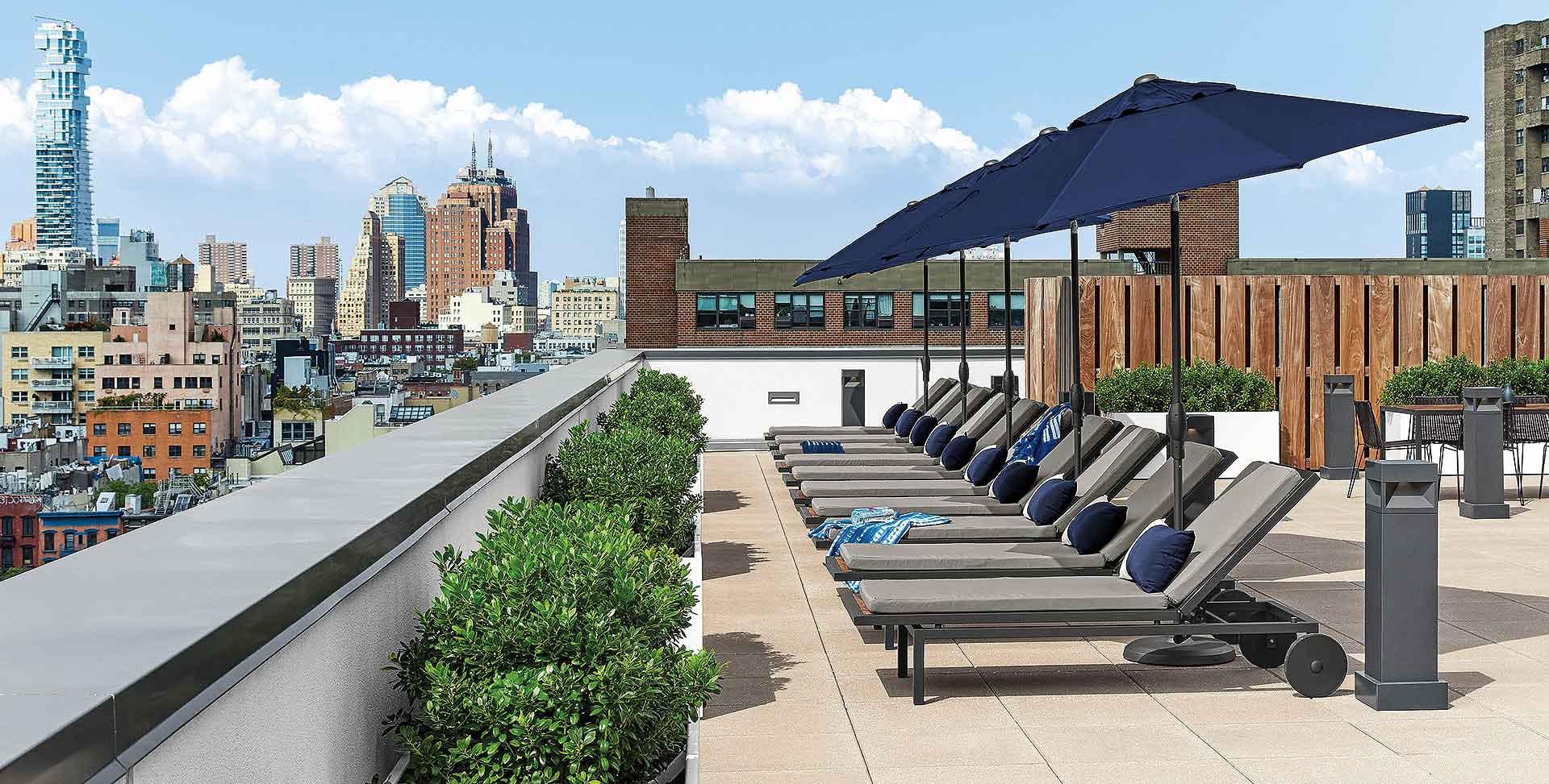 Montego outdoor chairs and navy Oahu umbrellas