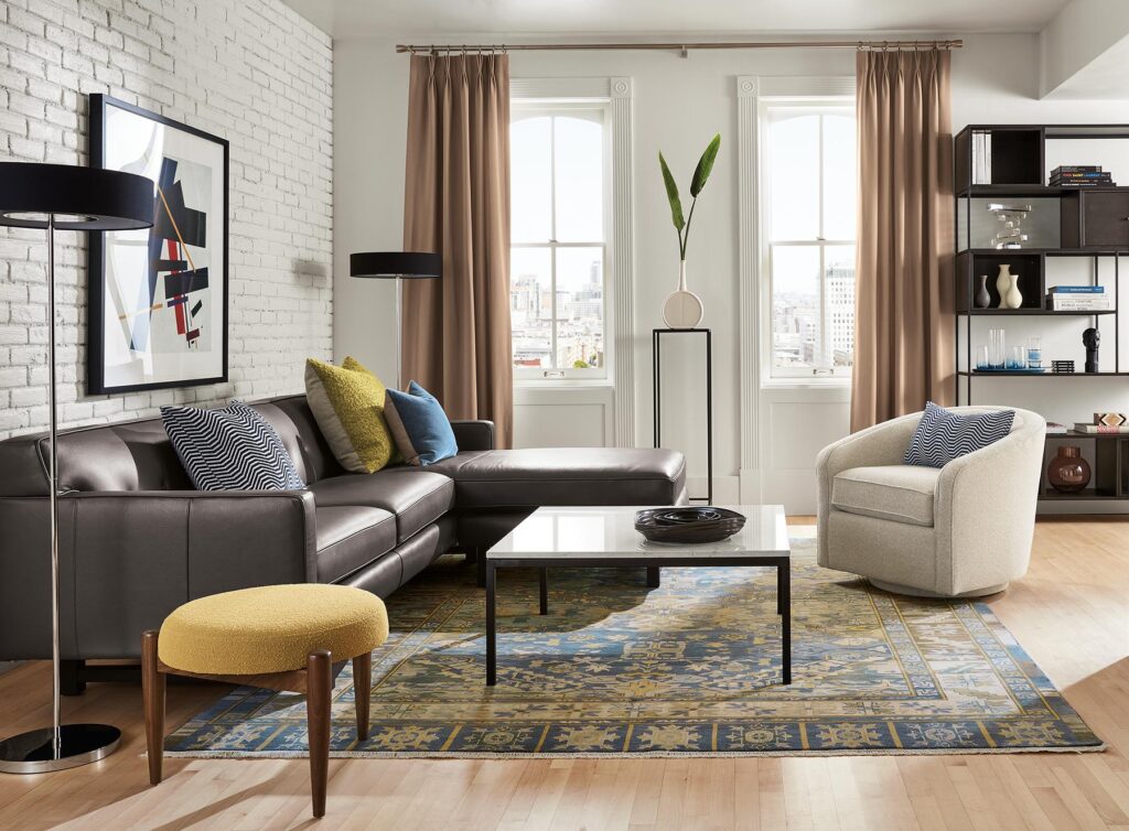 Living room with Andre leather sofa, Amos swivel accent chair, Kayseri rug.