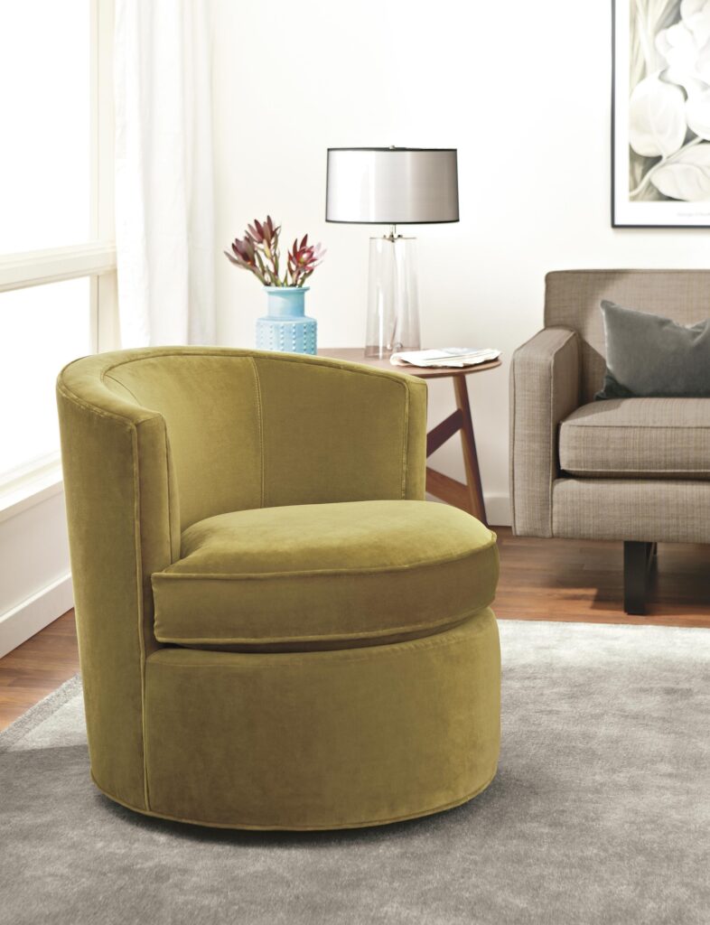 Otis swivel accent chair in living room.