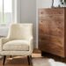 Detail image of Quinn accent chair in white fabric and Hudson dresser in walnut.