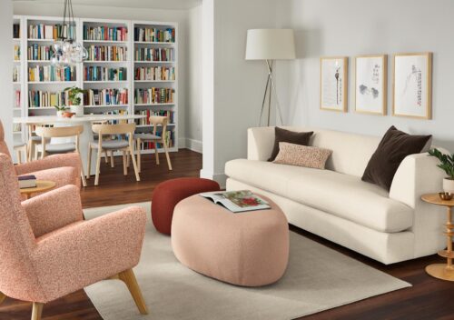 room setting with astaire sofa in sumner ivory, asher ottomans and boden chairs.
