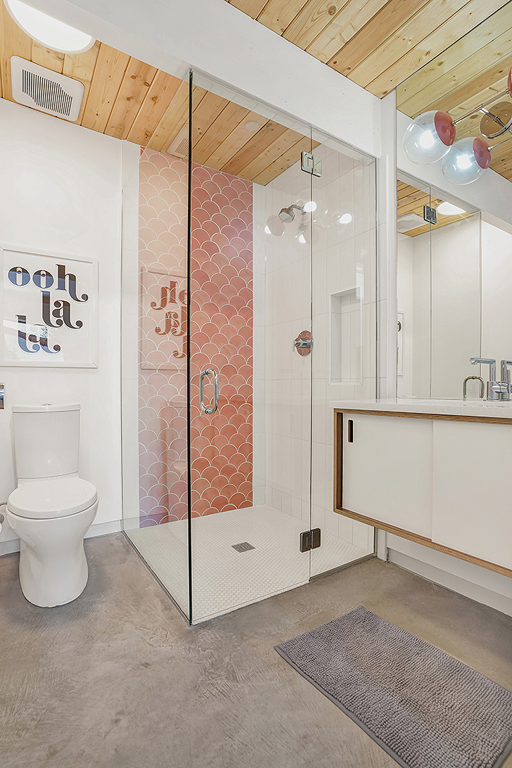 Modern bathroom with pink shower tiles