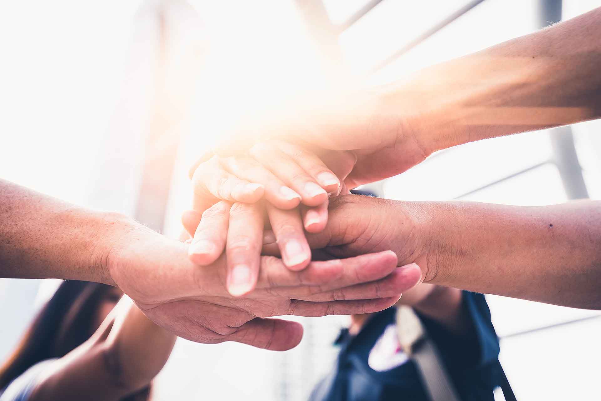 Hands are placed on top of each other