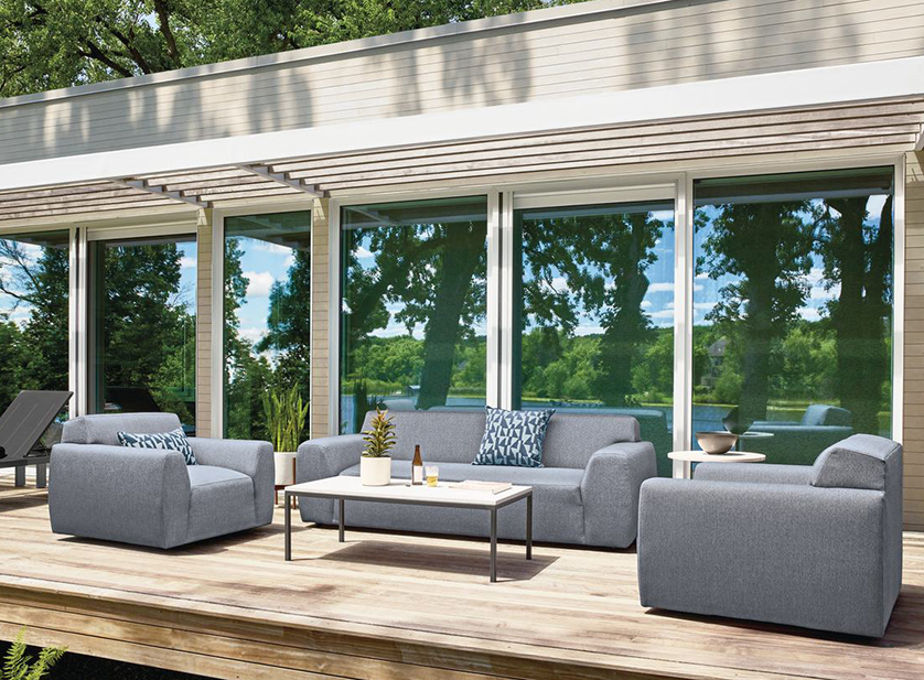 Drift outdoor sofa and swivel chairs with Parsons coffee table on wood deck.