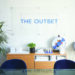 The Outset company sign behind their front desk.
