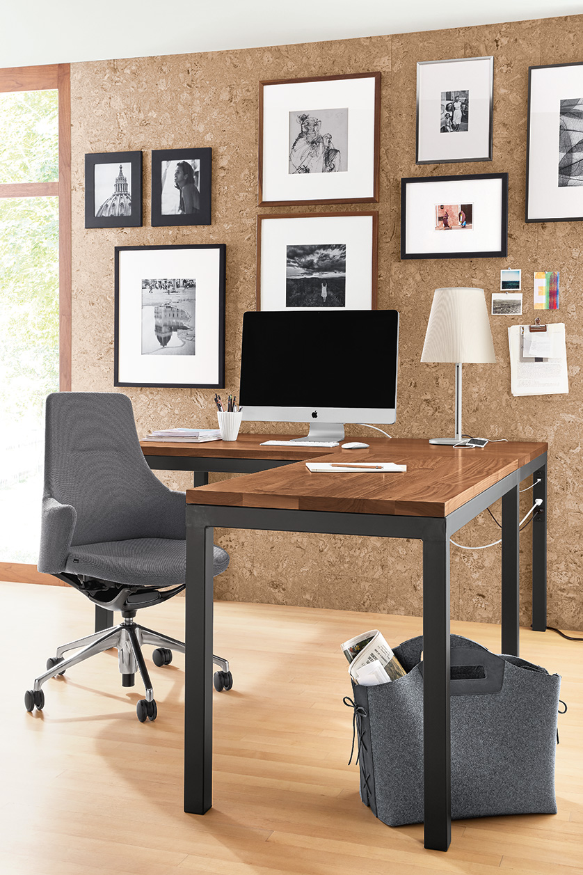 Home office with Parsons walnut L-shaped desk, LW Office Chair in grey,
Barlow table lamp and a gallery wall of Profile picture frames.