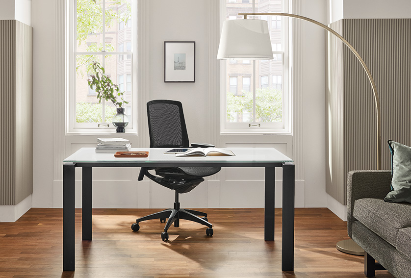 Home office with Rand table in natural steel, Finora office chair and Streeter floor lamp.
