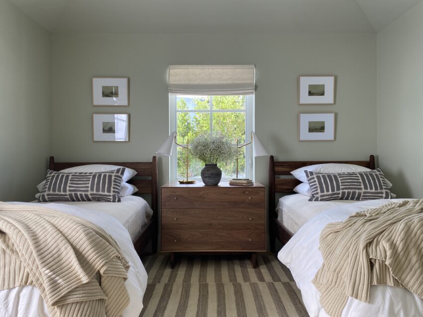 Grove twin beds and dresser in bedroom.