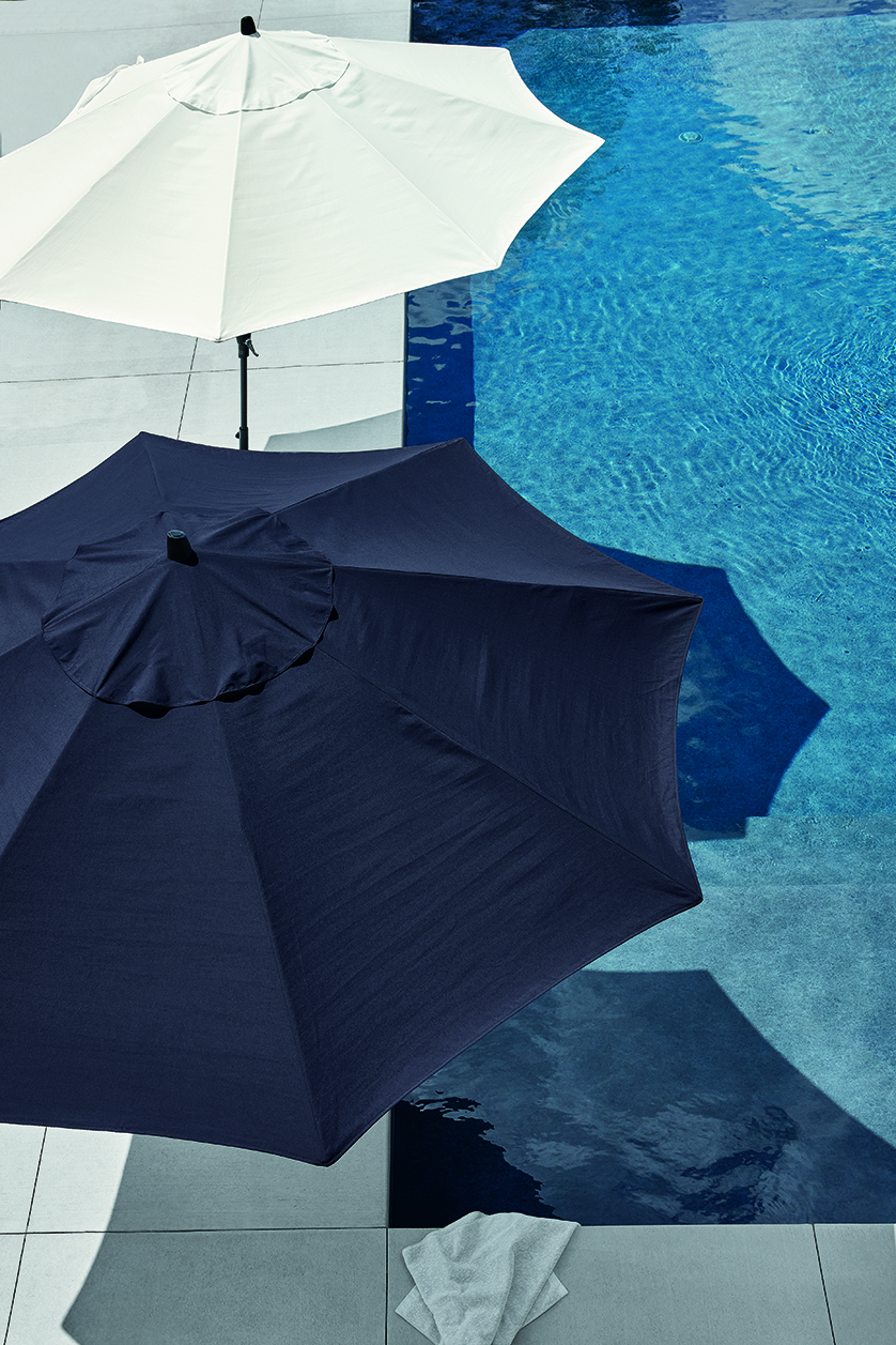Top-down view of navy and white patio umbrellas.