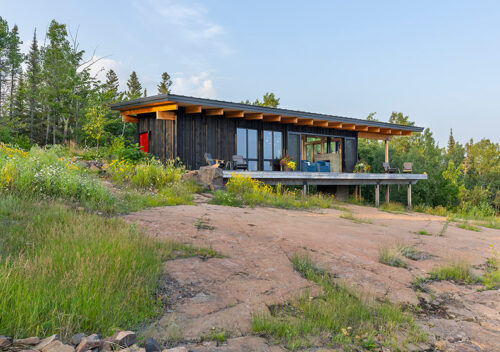 Small modern cabin exterior.